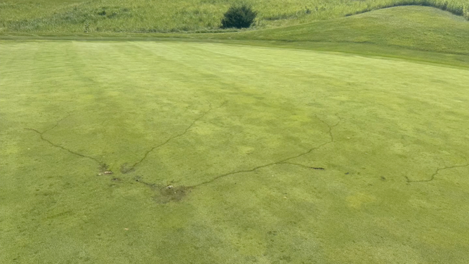 Burn scars on the golf course from the lightning strike.